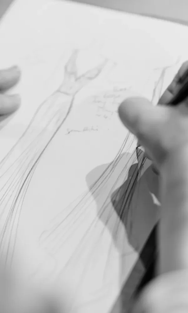 Anita, Creative Director of Vinka Design sketches couture bridal gown in the Auckland Atelier. Bridal since 1959.