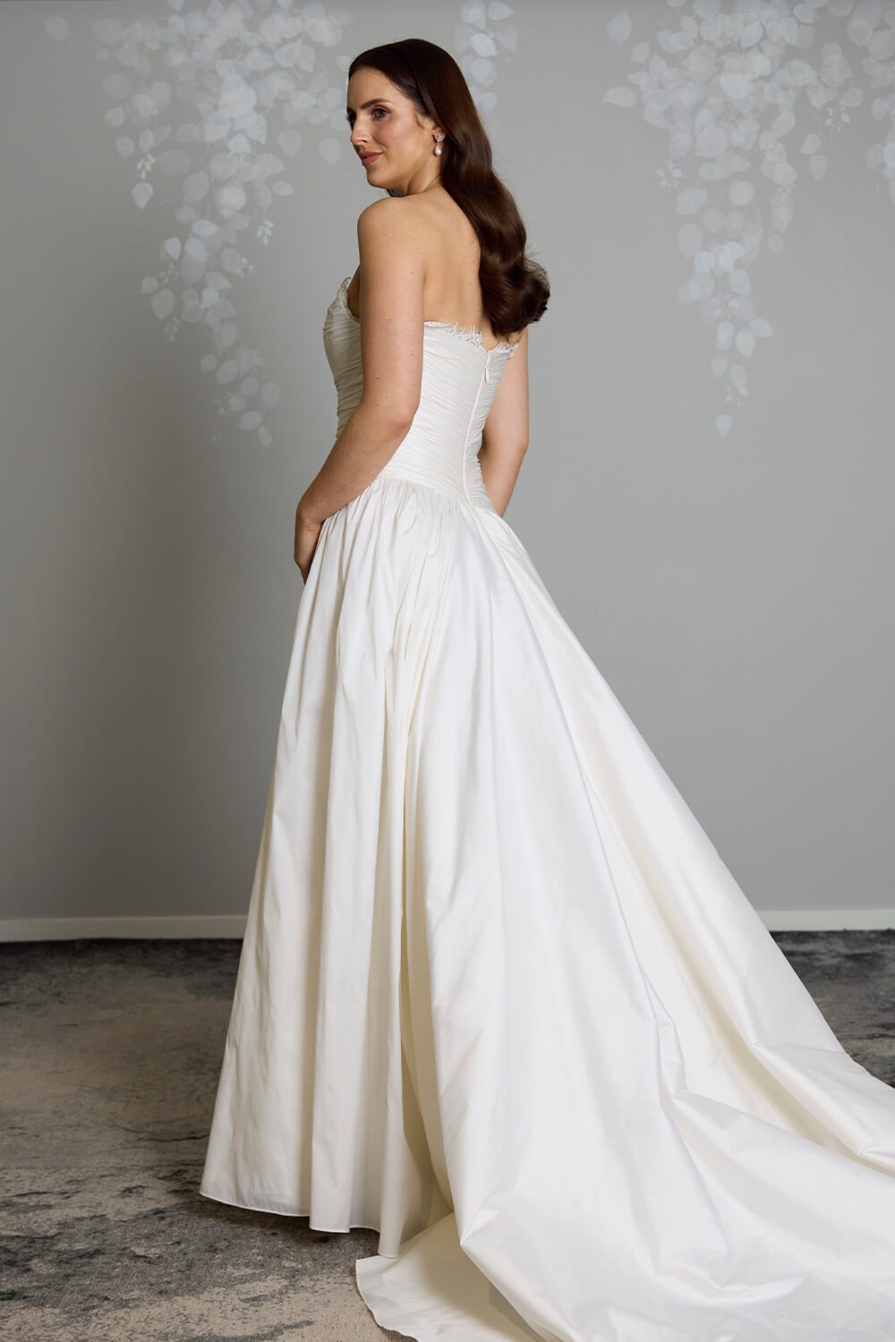 Amelia silk-touch taffeta wedding gown with dropped waist, draped bodice, lace neckline and full gathered skirt