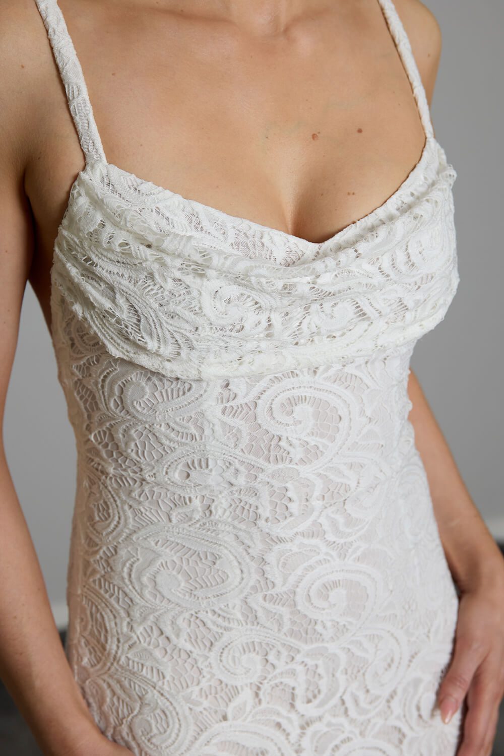 Cove stretch lace wedding dress with cowl neckline, low cross-strap back and light nude power stretch base