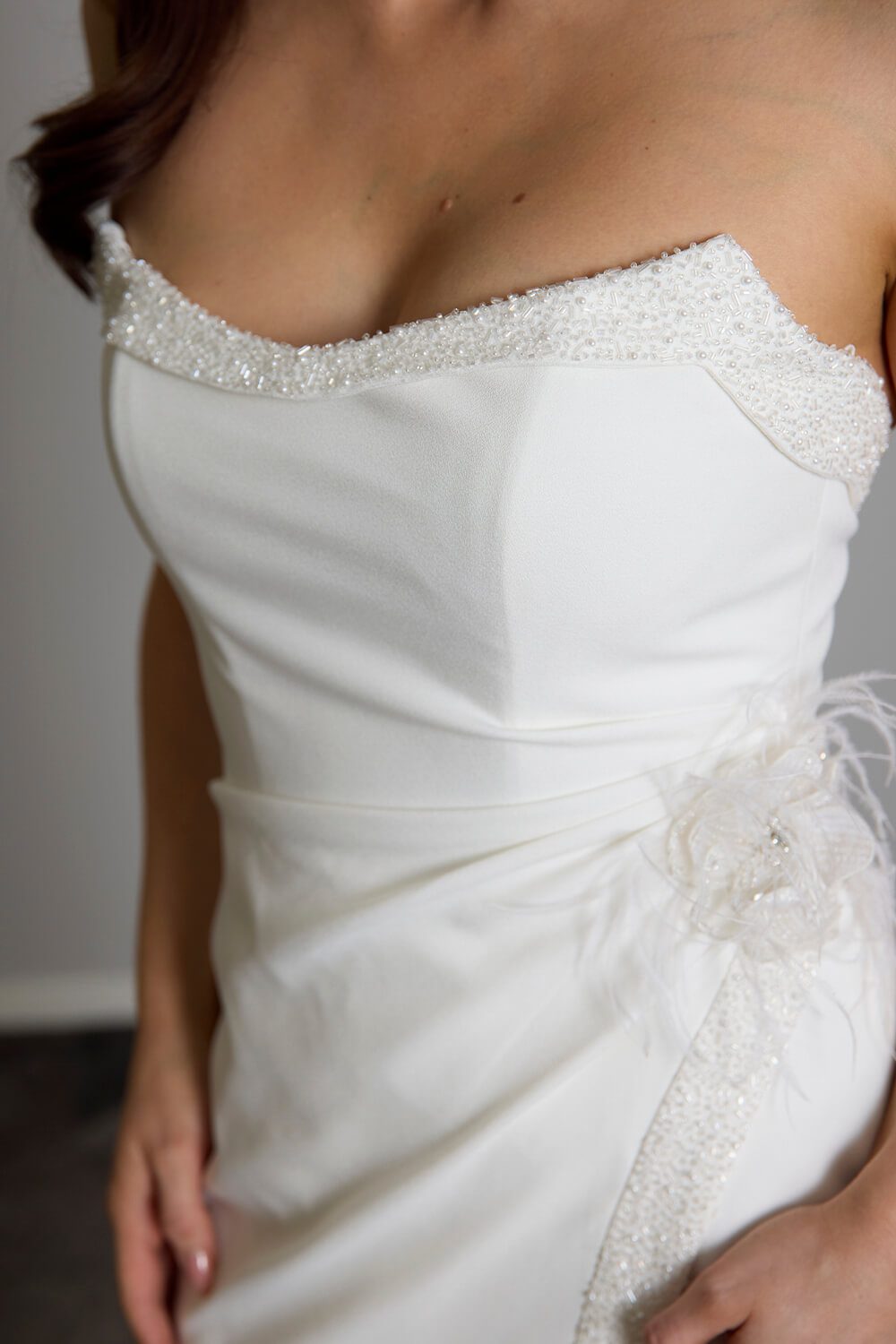 Hallie bridal crepe wedding gown with scoop neckline, seed pearl and bugle bead embellishment, crossover skirt and side split