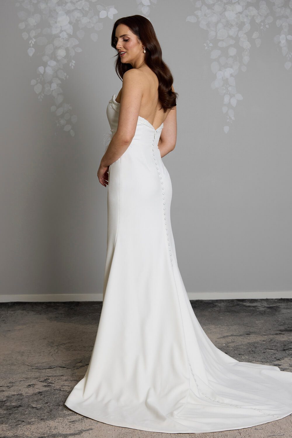 Hallie bridal crepe wedding gown with scoop neckline, seed pearl and bugle bead embellishment, crossover skirt and side split