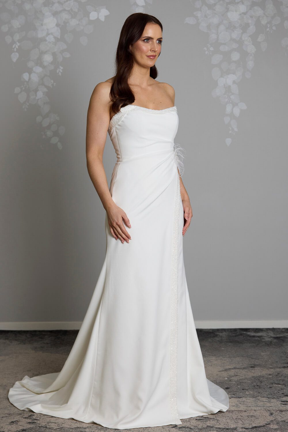 Hallie bridal crepe wedding gown with scoop neckline, seed pearl and bugle bead embellishment, crossover skirt and side split