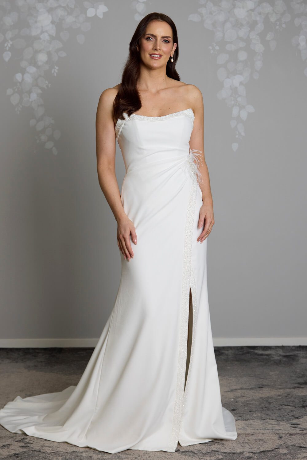 Hallie bridal crepe wedding gown with scoop neckline, seed pearl and bugle bead embellishment, crossover skirt and side split