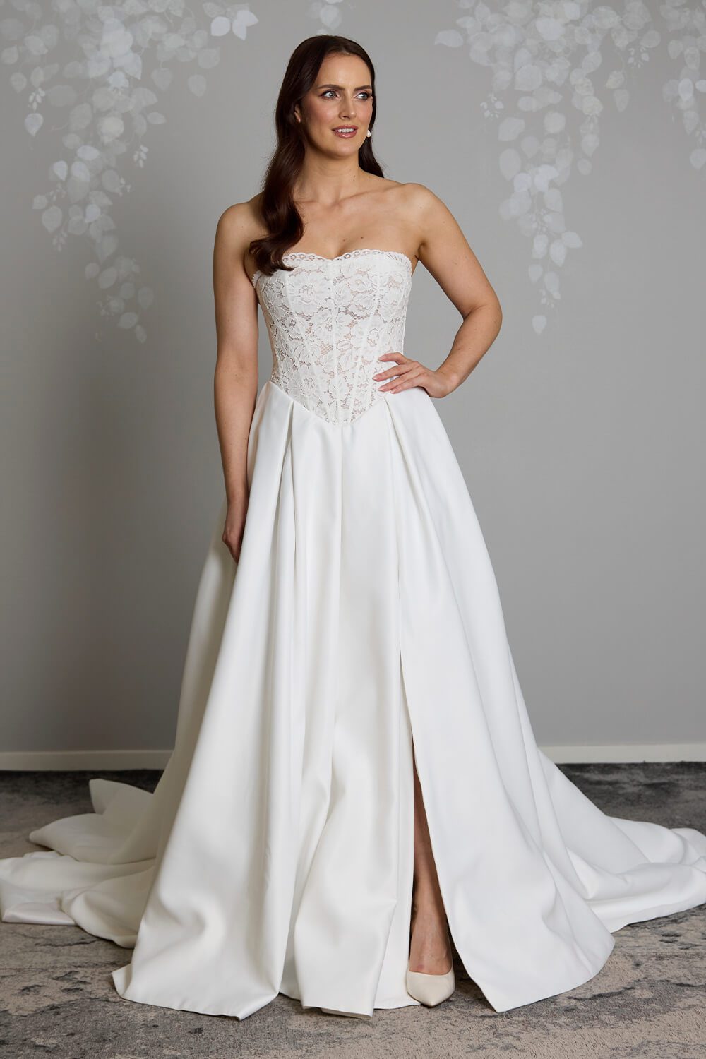 Indie strapless lace wedding dress with semi-sheer boned bodice, inverted pleated Duchesse satin skirt and button detailing down the back