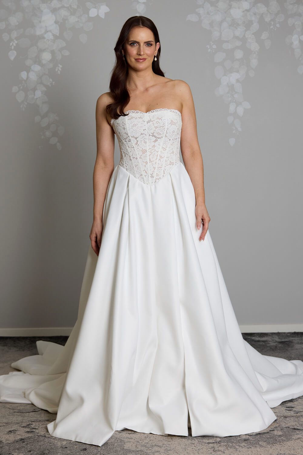 Indie strapless lace wedding dress with semi-sheer boned bodice, inverted pleated Duchesse satin skirt and button detailing down the back