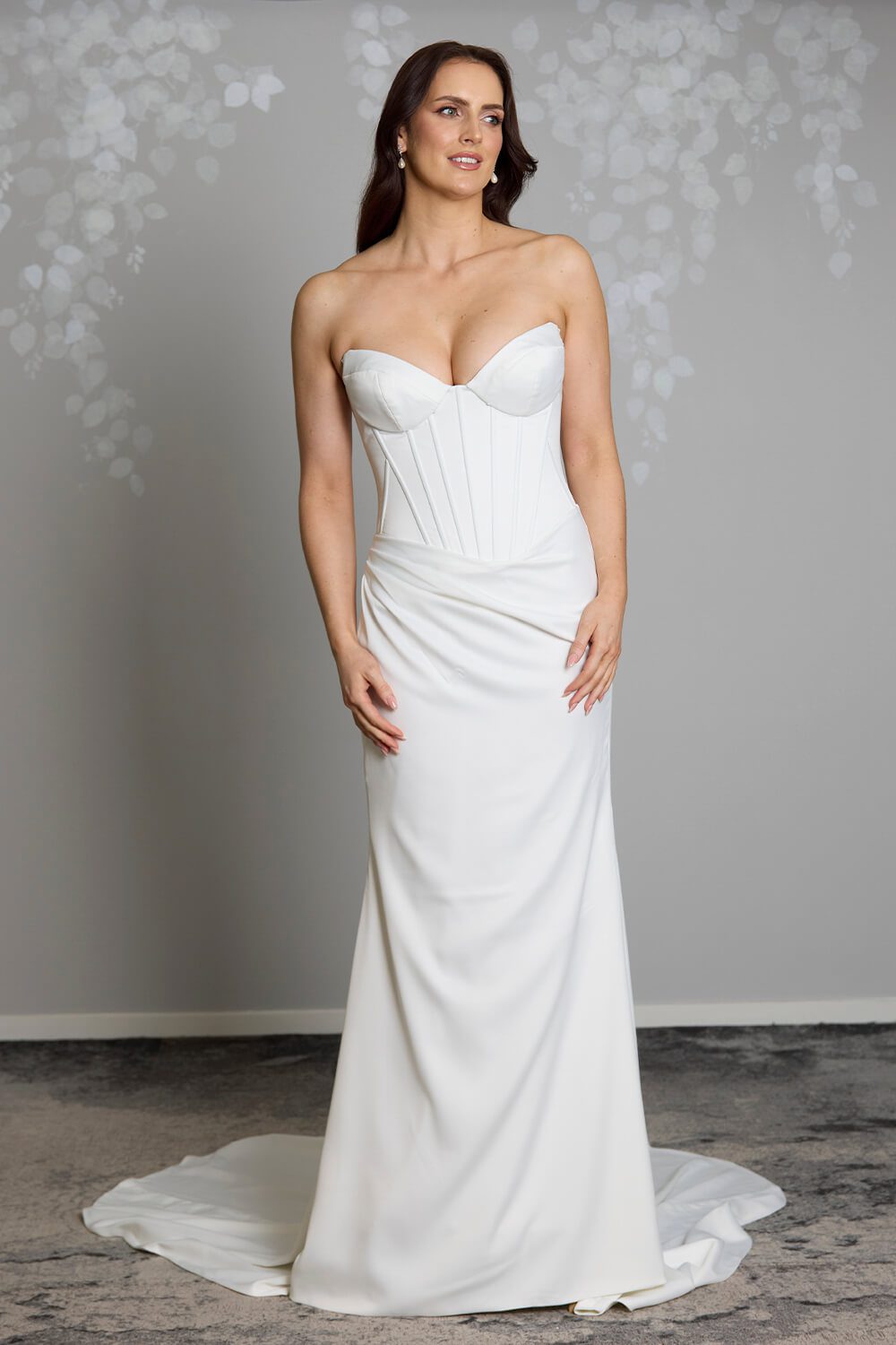 Noa Toscano soft satin corset wedding gown with exposed boning, draped slim skirt and crystal embellished off-shoulder detail