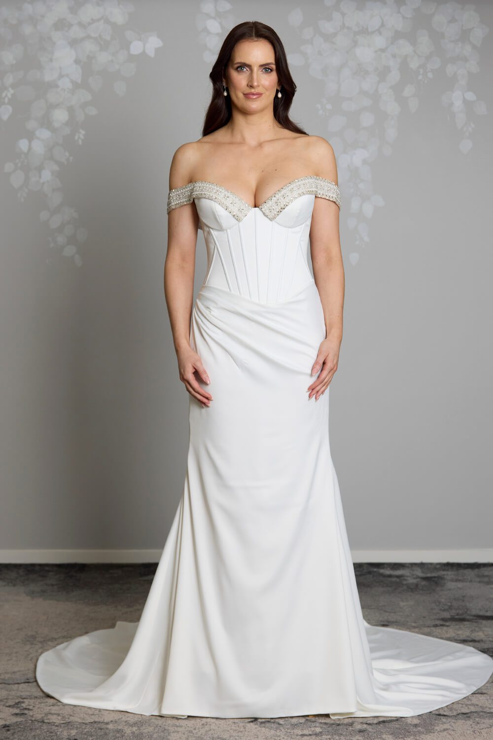 Noa Toscano soft satin corset wedding gown with exposed boning, draped slim skirt and crystal embellished off-shoulder detail