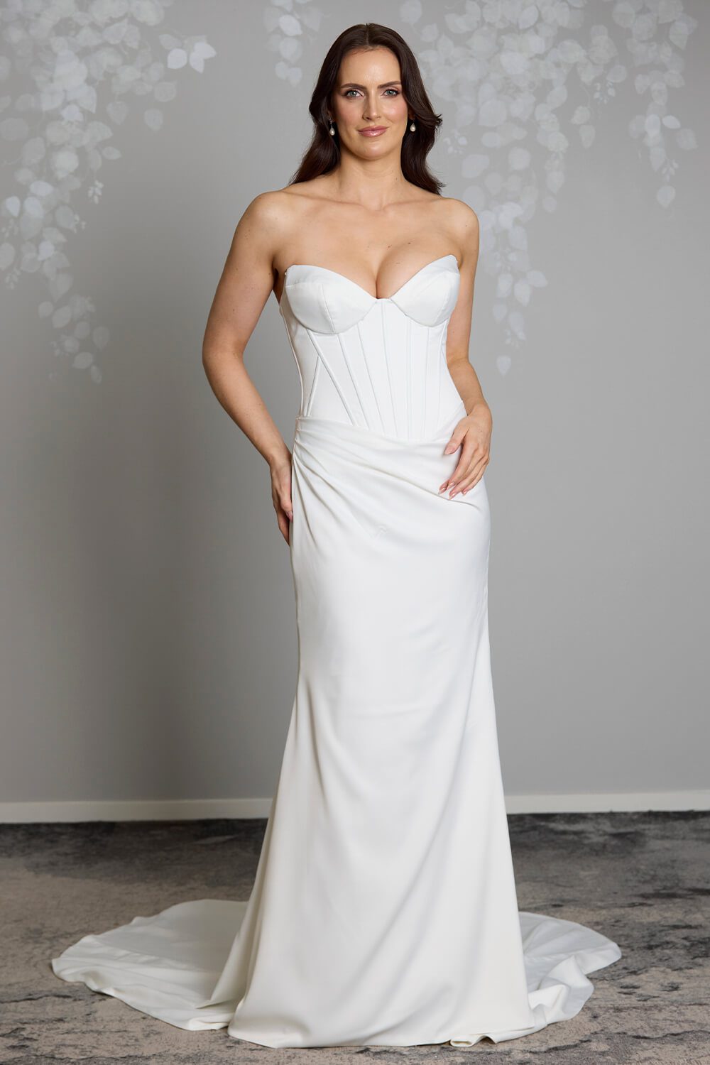 Noa Toscano soft satin corset wedding gown with exposed boning, draped slim skirt and crystal embellished off-shoulder detail