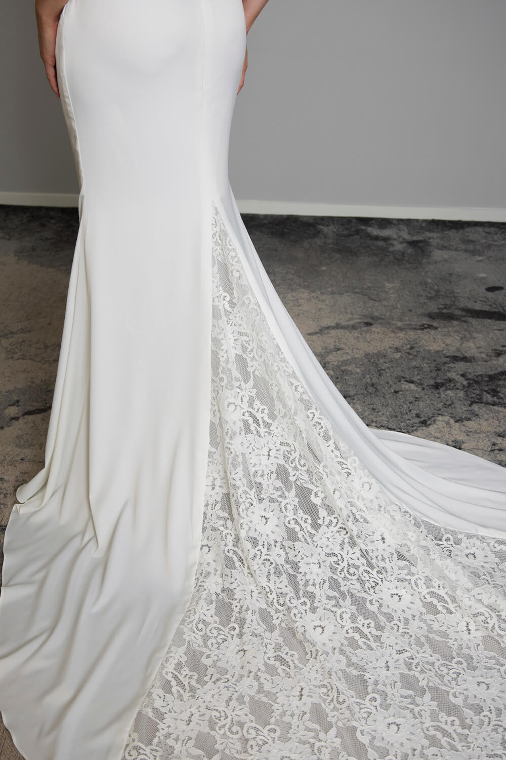 Odette two-piece satin wedding dress with structured corset bodice, lace back detailing, fit-and-flare skirt and lace train insert