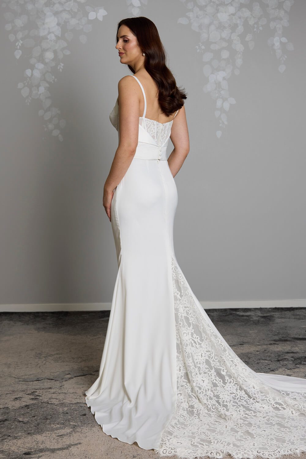 Odette two-piece satin wedding dress with structured corset bodice, lace back detailing, fit-and-flare skirt and lace train insert