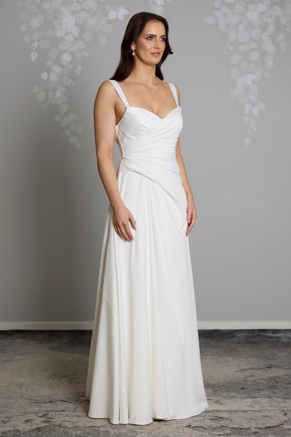 Taryn Toscano soft satin wedding gown with strapless draped bodice, gentle V neckline and detachable straps