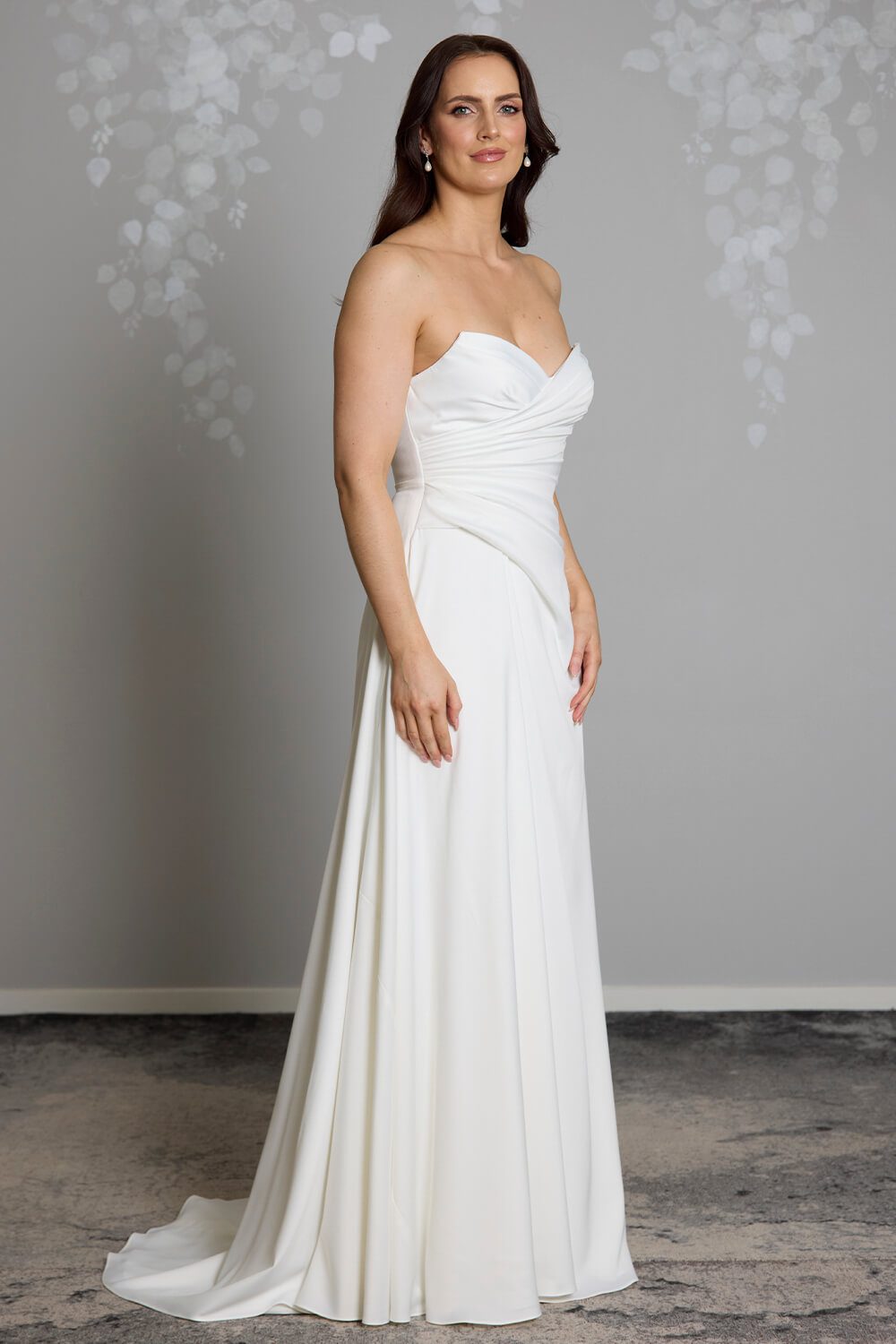 Taryn Toscano soft satin wedding gown with strapless draped bodice, gentle V neckline and detachable straps