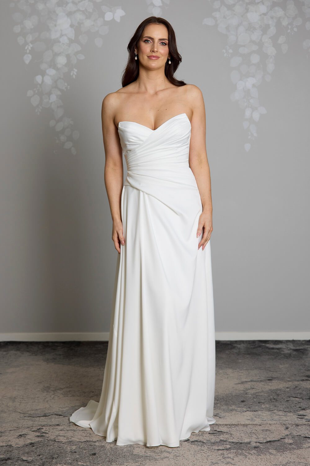 Taryn Toscano soft satin wedding gown with strapless draped bodice, gentle V neckline and detachable straps