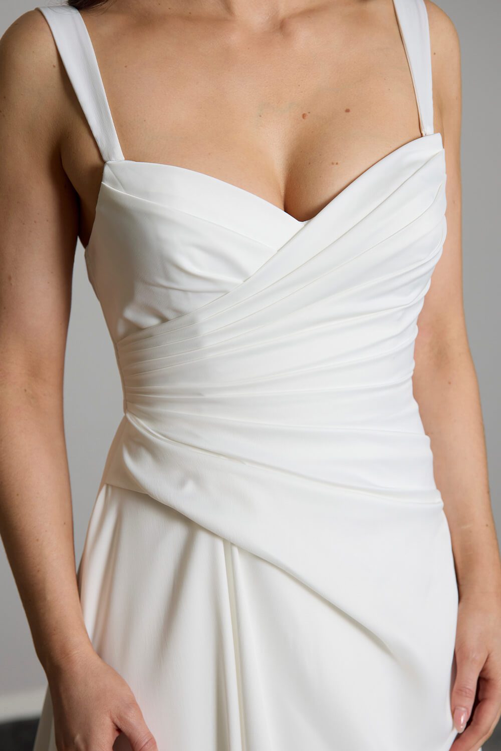Taryn Toscano soft satin wedding gown with strapless draped bodice, gentle V neckline and detachable straps