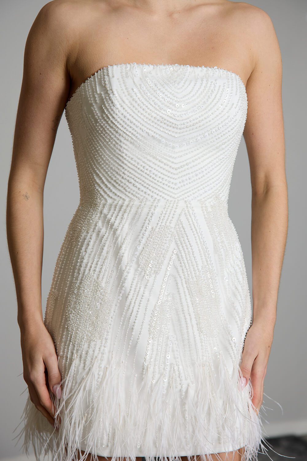 Carrie strapless iridescent beaded bridal mini dress with feather-trimmed hem