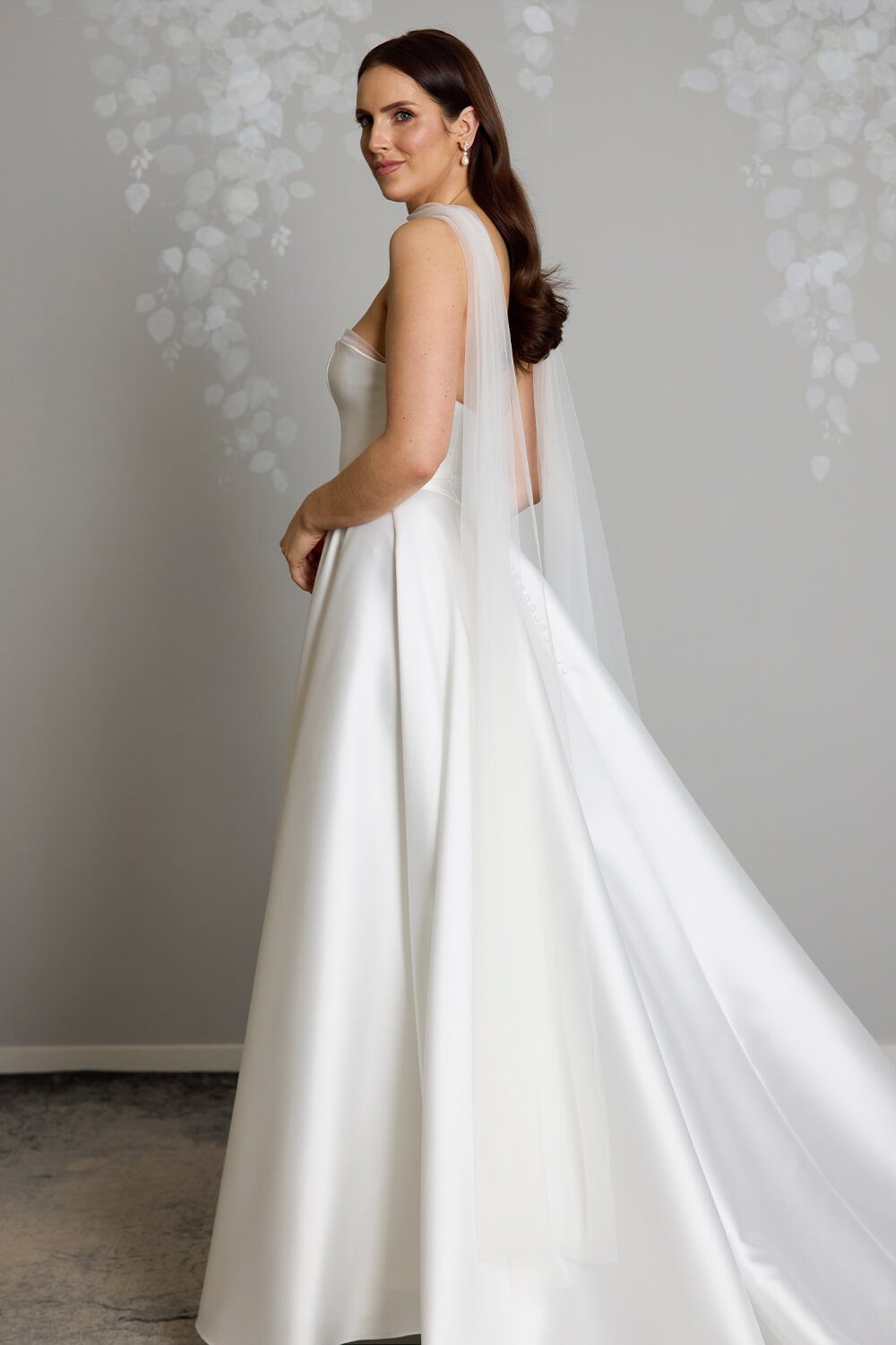 Bella tulle bridal scarf styled with the Millie wedding gown by Vinka Design, featuring delicate, flowing tulle for a soft and romantic bridal look.