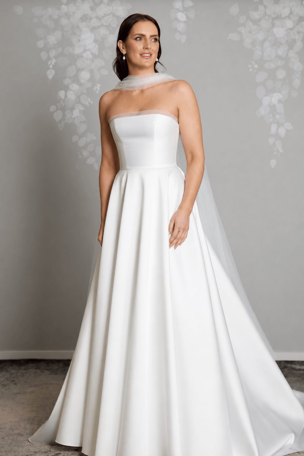 Bella tulle bridal scarf styled with the Millie wedding gown by Vinka Design, featuring delicate, flowing tulle for a soft and romantic bridal look.