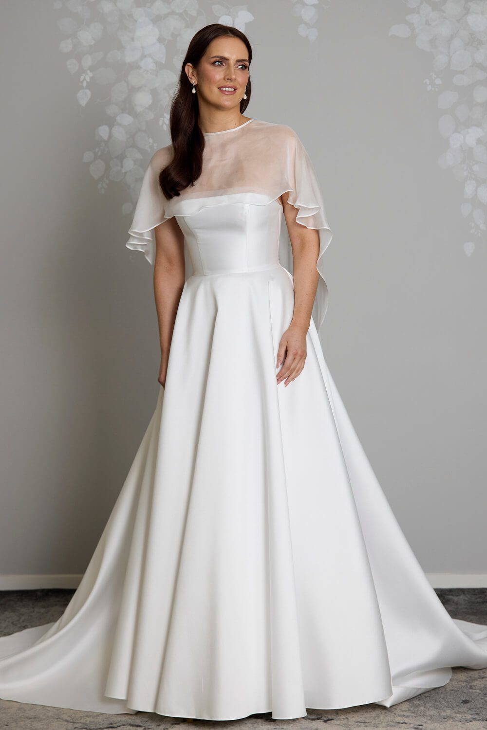 Esther silk chiffon bridal mantle by Vinka Design, featuring sheer, flowing panels draped over the shoulders and cascading down the back of the wedding gown.