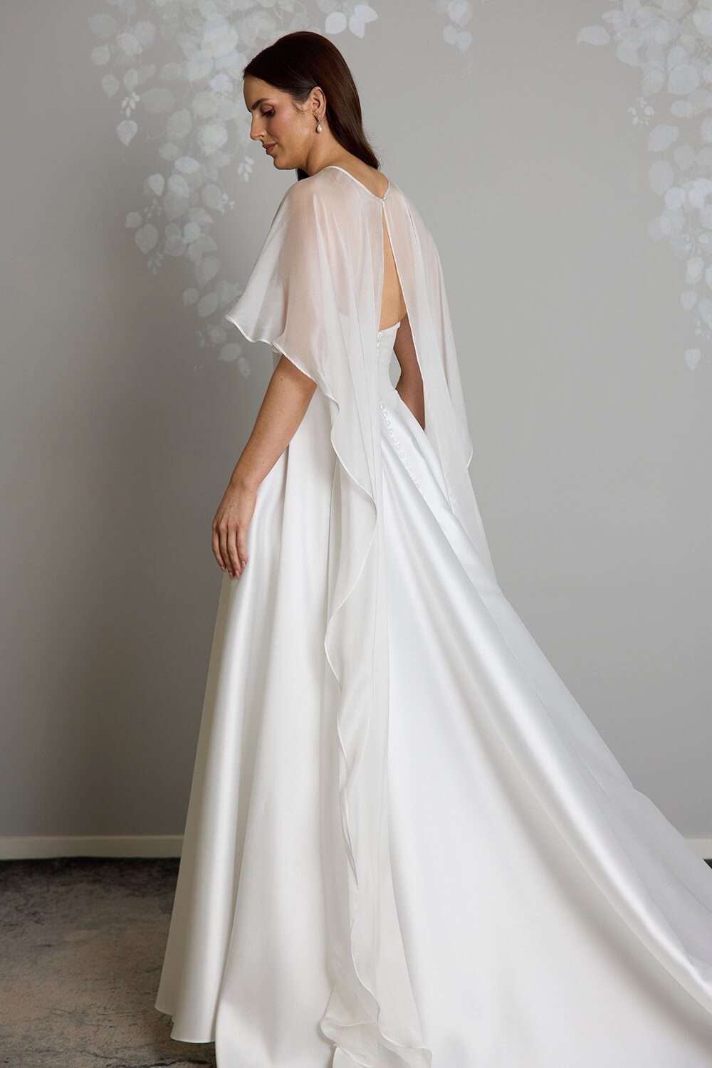 Esther silk chiffon bridal mantle by Vinka Design, featuring sheer, flowing panels draped over the shoulders and cascading down the back of the wedding gown.