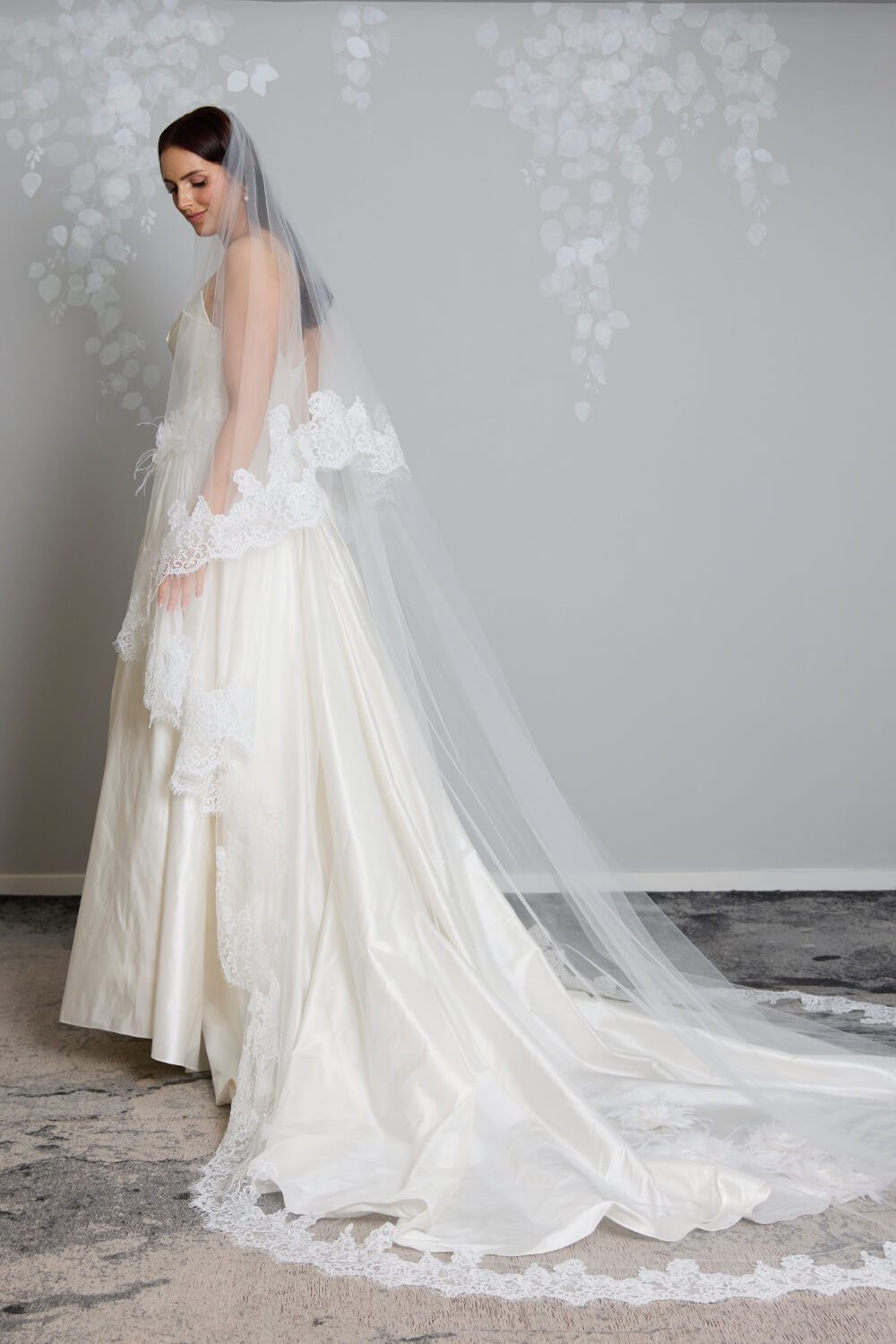 Grace two-tier bridal veil by Vinka Design, crafted from light ivory tulle with a corded Chantilly lace edge and 80 cm blusher, styled with an ivory wedding gown.